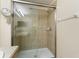 Tile shower with glass doors showcases a clean and modern design at 1216 Priory Cir, Winter Garden, FL 34787