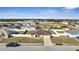 Aerial view of house with well-manicured lawn in a neighborhood at 1317 Conch Key Ln, Davenport, FL 33837