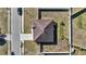 Overhead view of house showing roof detail, backyard, and proximity to road at 1317 Conch Key Ln, Davenport, FL 33837