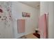 Bright bathroom featuring a bathtub with shower and neutral paint at 1317 Conch Key Ln, Davenport, FL 33837