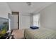 Bright bedroom featuring carpet flooring, neutral paint and a window for natural light plus a wardrobe at 1317 Conch Key Ln, Davenport, FL 33837