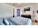 Inviting bedroom with a TV, dresser, and closet providing ample storage space at 1317 Conch Key Ln, Davenport, FL 33837