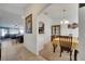 This dining room features a modern chandelier and decorative cabinet for storing glassware at 1317 Conch Key Ln, Davenport, FL 33837
