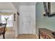 Bright foyer with tile flooring, a white front door, and stylish decor at 1317 Conch Key Ln, Davenport, FL 33837