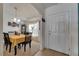 Welcoming foyer with tile flooring and direct access to a dining area at 1317 Conch Key Ln, Davenport, FL 33837