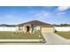 Inviting one-story home with manicured lawn, an attached garage, and a neatly maintained exterior at 1317 Conch Key Ln, Davenport, FL 33837