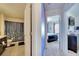 Hallway view of bathroom with a shower and a bedroom at 1317 Conch Key Ln, Davenport, FL 33837