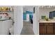 Hallway showing laundry room, bathroom, and living room at 1317 Conch Key Ln, Davenport, FL 33837