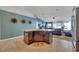 Kitchen featuring an island with seating that connects to the living room in an open concept home at 1317 Conch Key Ln, Davenport, FL 33837