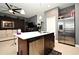 Open concept kitchen with island and stainless steel appliances at 1389 Captiva Cv # 20, Sanford, FL 32771