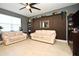 Living room with light beige sofa and an accent wall at 1389 Captiva Cv # 20, Sanford, FL 32771