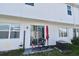 Cozy patio featuring a red umbrella and outdoor seating at 1389 Captiva Cv # 20, Sanford, FL 32771