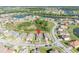 An aerial view of a residential neighborhood with lush landscaping and scenic lakes at 1511 Goblet Cove St, Kissimmee, FL 34746