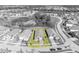 An aerial view showcases this homes roof, landscaping, surrounding neighborhood, nearby community features, and lake views at 1511 Goblet Cove St, Kissimmee, FL 34746