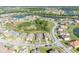 An aerial view of a residential neighborhood with lush landscaping and scenic lakes at 1511 Goblet Cove St, Kissimmee, FL 34746