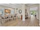 Elegant dining room with a stylish chandelier, neutral color scheme, and seamless flow into other living areas at 1511 Goblet Cove St, Kissimmee, FL 34746