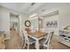 Elegant dining room with a stylish chandelier, neutral color scheme, and seamless flow into other living areas at 1511 Goblet Cove St, Kissimmee, FL 34746