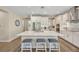Stylish kitchen featuring an island with seating, stainless steel appliances, and ample white cabinetry at 1511 Goblet Cove St, Kissimmee, FL 34746