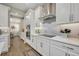 Modern kitchen design with stainless steel appliances, sleek cabinetry, and a stylish backsplash at 1511 Goblet Cove St, Kissimmee, FL 34746