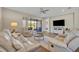 Comfortable living room with a view of the screened lanai, and seamless access to the outdoor space at 1511 Goblet Cove St, Kissimmee, FL 34746