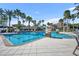 Resort style pool with palm trees, fountains, and plenty of space to relax in the Florida sunshine at 1511 Goblet Cove St, Kissimmee, FL 34746