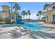 Beautiful community pool featuring a fun water slide and tropical landscaping for a refreshing experience at 1511 Goblet Cove St, Kissimmee, FL 34746