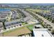 Aerial view showing townhome community and surrounding landscape at 15508 Blackbead St, Winter Garden, FL 34787