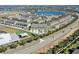 Aerial view of townhouses near a lake and park at 15508 Blackbead St, Winter Garden, FL 34787