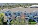 Aerial view of light green townhouses with landscaping at 15508 Blackbead St, Winter Garden, FL 34787