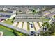 Aerial view of townhouses, garages, and nearby community amenities at 15508 Blackbead St, Winter Garden, FL 34787