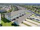 Aerial view of townhouses, highlighting private garages and landscape at 15508 Blackbead St, Winter Garden, FL 34787
