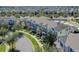 Aerial view showcasing row of townhouses and neighborhood at 15508 Blackbead St, Winter Garden, FL 34787