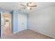 Light blue-walled bedroom with double-door closet at 15508 Blackbead St, Winter Garden, FL 34787