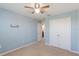 Bedroom with light blue walls and ceiling fan at 15508 Blackbead St, Winter Garden, FL 34787