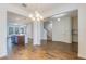 Open dining room with kitchen and staircase views at 15508 Blackbead St, Winter Garden, FL 34787