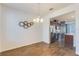 Dining area with kitchen view, hardwood floors at 15508 Blackbead St, Winter Garden, FL 34787