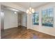 Bright dining room with chandelier and wood-look tile floors at 15508 Blackbead St, Winter Garden, FL 34787