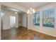 Bright dining room with chandelier and wood-look tile floors at 15508 Blackbead St, Winter Garden, FL 34787