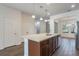 Island kitchen with stainless steel appliances and tile flooring at 15508 Blackbead St, Winter Garden, FL 34787