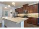 Modern kitchen with island and stainless steel appliances at 15508 Blackbead St, Winter Garden, FL 34787