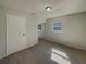 Bedroom with mirrored closet and neutral decor at 15662 Se 88Th Ct, Summerfield, FL 34491