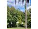 Outdoor basketball court nestled in a wooded area, featuring two hoops at 203 Crown Oaks Way # 202, Longwood, FL 32779