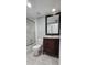 Updated bathroom with vanity, toilet and shower at 203 Crown Oaks Way # 202, Longwood, FL 32779