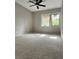 Bright bedroom with large window and carpet at 203 Crown Oaks Way # 202, Longwood, FL 32779
