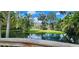 Scenic pond view with wooden bridge at 203 Crown Oaks Way # 202, Longwood, FL 32779