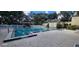 Community pool with surrounding patio at 203 Crown Oaks Way # 202, Longwood, FL 32779