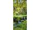 Scenic river with a wooden bridge and lush vegetation at 203 Crown Oaks Way # 202, Longwood, FL 32779