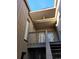Exterior condo stairs leading to a private entrance with a balcony at 203 Crown Oaks Way # 202, Longwood, FL 32779