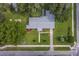 Overhead photo of a home boasting lovely landscaping and nearby roads at 2311 Sw 3Rd St, Ocala, FL 34471