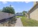 Paver walkway through backyard with fire pit and covered patio at 2537 Lanier Rd, Kissimmee, FL 34744
